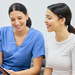 dental team member going over financial information with a patient