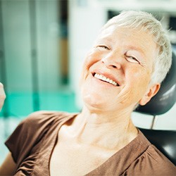 older woman smiling in the dental chair